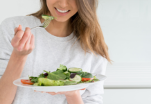 Eating salad.