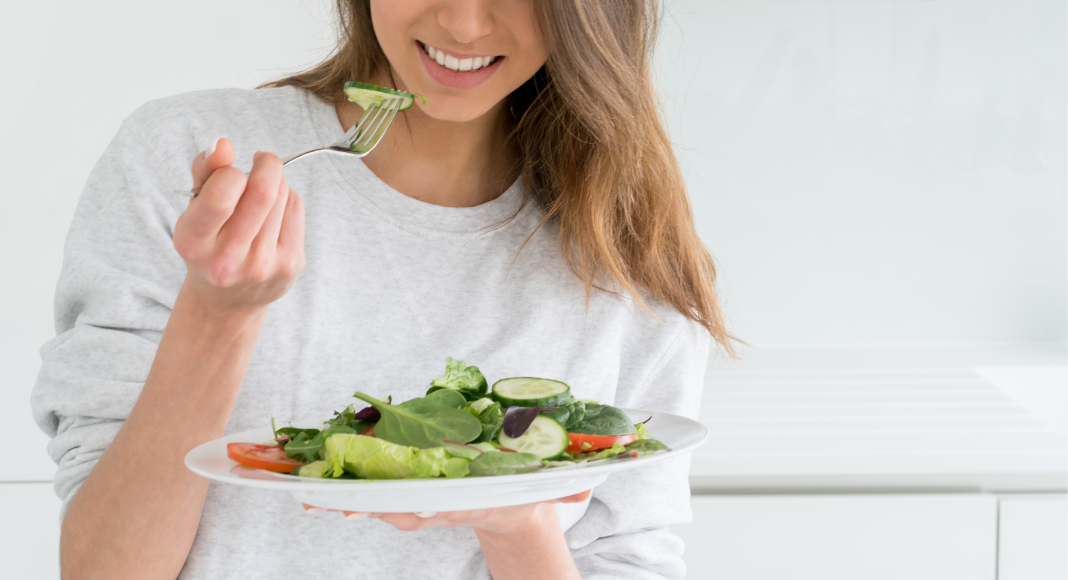 Eating salad.