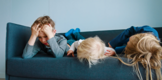 Why Boredom Is Actually Good for Children (Especially in Today’s World) Children laying on a couch bored.