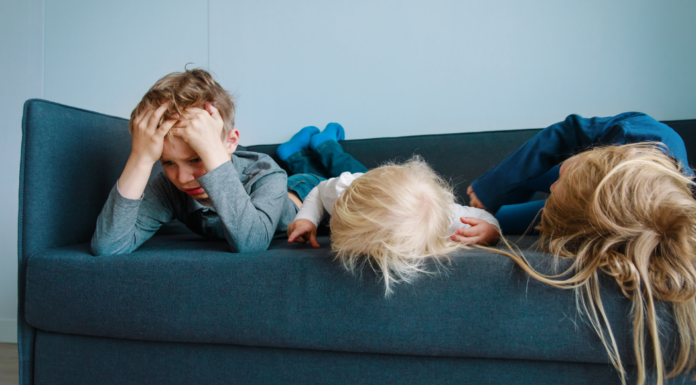Why Boredom Is Actually Good for Children (Especially in Today’s World) Children laying on a couch bored.
