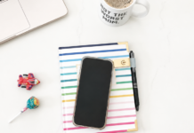 Child-Free Content: A 30-Second Break from Mom Life A phone placed on an agenda book next to a computer and coffee.
