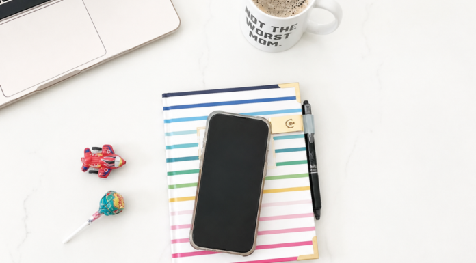 Child-Free Content: A 30-Second Break from Mom Life A phone placed on an agenda book next to a computer and coffee.